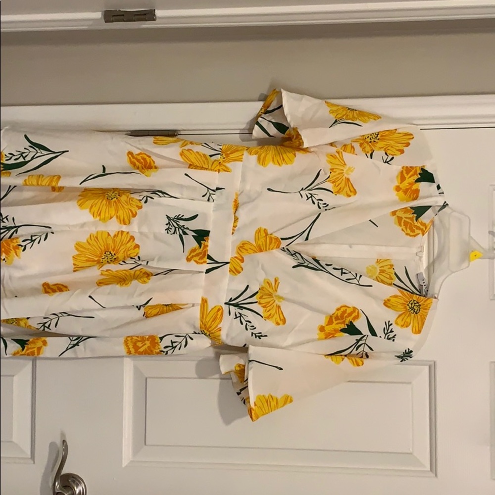 A cute flower romper with a tie belt!